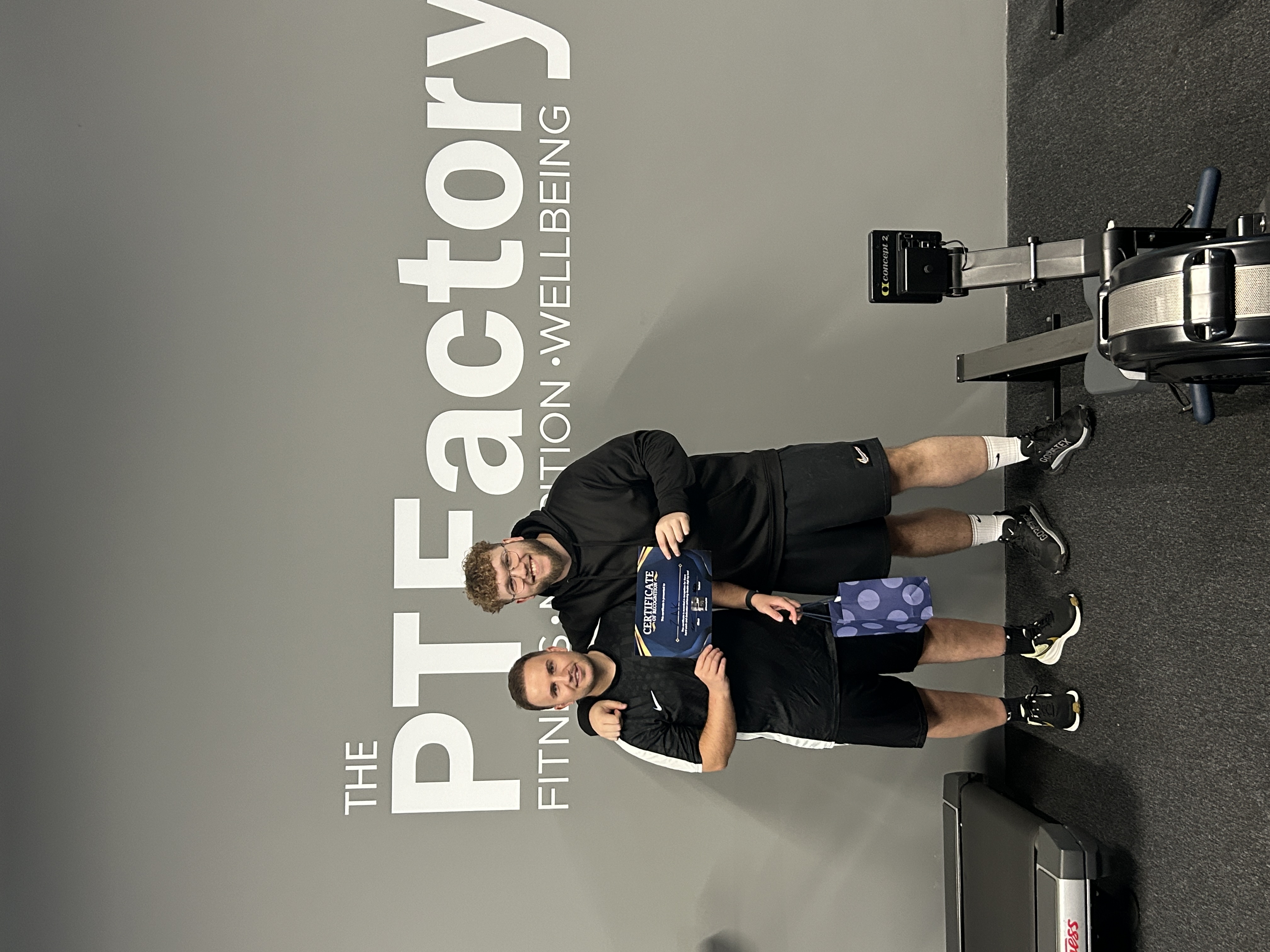 Kallum with Zak celebrating his weight loss achievement at PT Factory